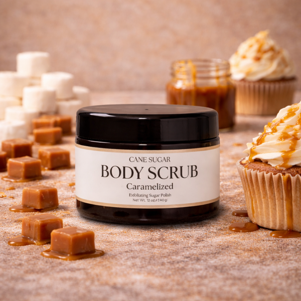 Jar of cane sugar body scrub with caramel and cupcakes on a wooden surface