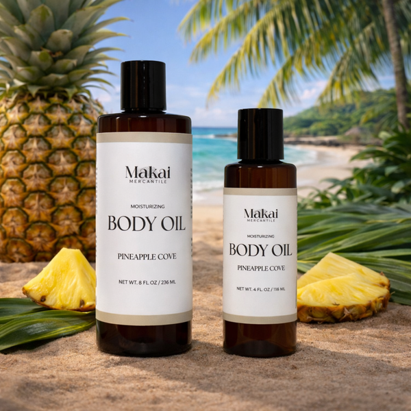 Two bottles of Makai Body Oil with pineapples and a tropical background