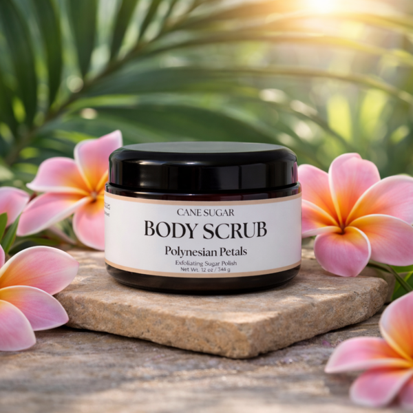 Jar of cane sugar body scrub with Polynesian Petals on a stone surface with flowers in the background
