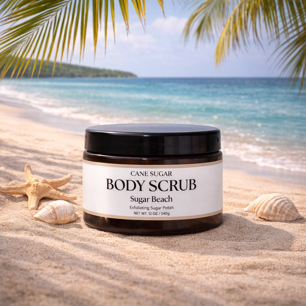 Cane Sugar Body Scrub jar on a beach with palm leaves and ocean in the background
