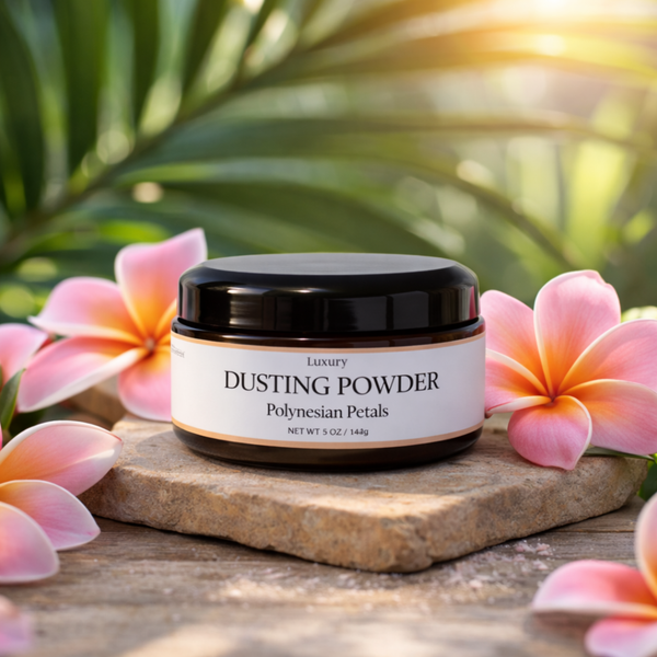 Jar of dusting powder with Polynesian Petals scent name on a wooden surface with flowers in the background